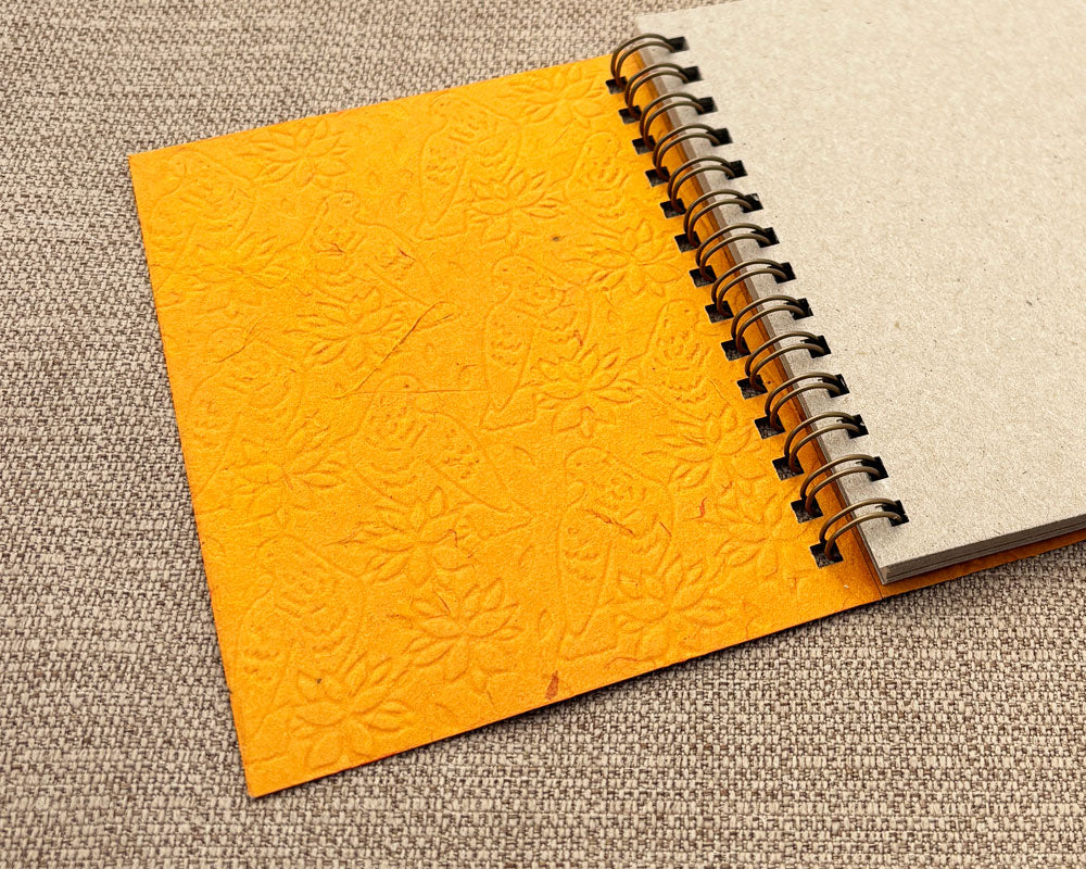Small embossed notebook Orange Birds