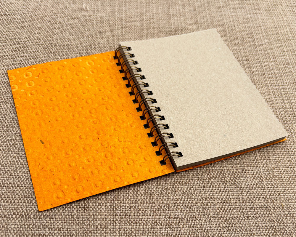 Small embossed notebook Orange Spotty