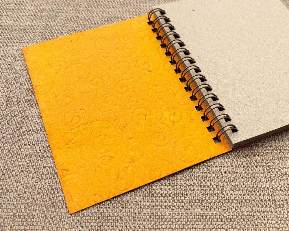 Small embossed notebook Orange Swirl